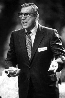 JOHN WOODEN was coach of the UCLA Bruins in 1964. They finished the season undefeated winning the first NCAA championship in school history. It was the first of many titles for Wooden and the Bruins.