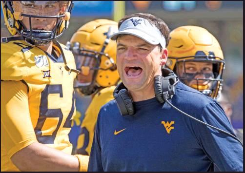 WEST VIRGINIA head coach Neal Brown yells at a referee during a college football game against North Carolina State Sept. 14 in Morgantown, W.Va. The Mountaineers open Big 12 play Saturday at Kansas. (AP Photo)