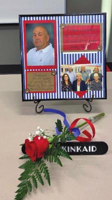 Gifts, a rose and a special picture of the Board members were placed at the late Dr. David Kinkaid’s Board seat for his family. One of the cards stated “A Hero is someone who has given all his life to something greater than oneself.”