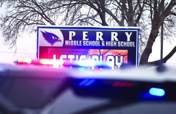 POLICE RESPOND to a school shooting at the Perry Middle School and High School complex on Jan. 4, 2024 in Perry, Iowa. Students were returning to classes following the holiday break. (Scott Olson/Getty Images/TNS)