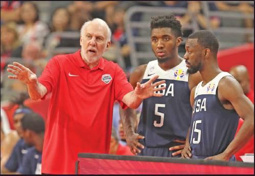 UNITED STATES’ coach Gregg Popovich, left, talks to Donovan Mitchell, center and Kemba Walker at right for the FIBA Basketball World Cup in Dongguan in southern China’s Guangdong province on Sept. 12. The U.S. will leave the World Cup with its worst finish ever in a major international tournament, assured of finishing no better than seventh after falling to Serbia 94-89 in a consolation playoff game. (AP Photo)