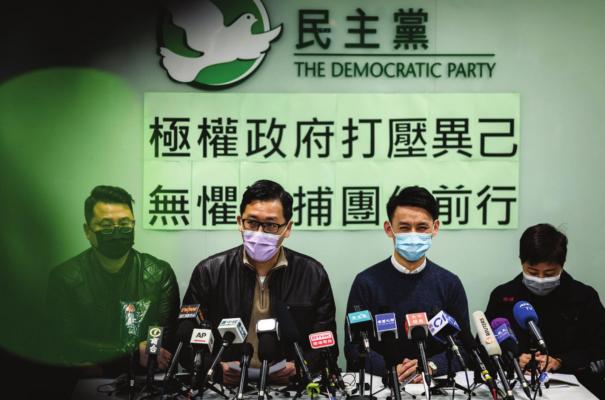 Democratic Party members Andrew Wan, from left, Lam Cheuk-ting, Lo Kin-hei, and Helena Wong address a press conference at the party’s office in Hong Kong on Jan. 8, 2021. (Anthony Wallace/ AFP/Getty Images/TNS)