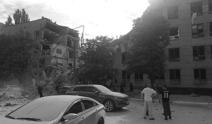 RESIDENTS VIEW damage from a Russian missile attack on the city of Kryvyi Rih, Ukraine on July 31, 2023. Residential buildings, a university building, a crossroads were hit. (Cover Images via Zuma Press/TNS)