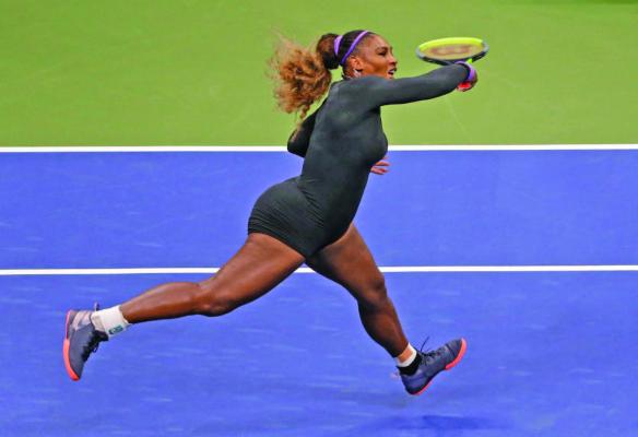SERENA WILLIAMS of the United States follows through on a forehand to Qiang Wang of China during the quarterfinals of the U.S. Open tennis tournament Tuesday in New York. Williams won the match in 44 minutes.