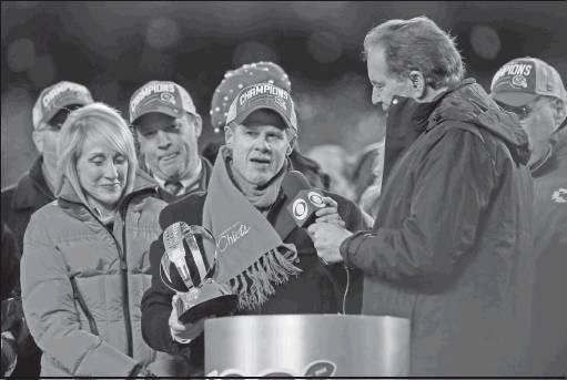 CLARK HUNT, chairman and CEO of the Kansas City Chiefs, center, and his mother Norma Clark, left, speak after the AFC Championship game against the Tennessee Titans Sunday in Kansas City, Mo. The Chiefs won 35-24 to advance to Super Bowl 54. The Hunt family finall got to receive the AFC championship trophy named after Clark’s late father, Lamar. (AP Photo)