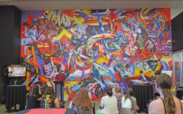 Yatika Star Fields providing brief remarks on the mural that he had painted for the NOC Cultural Engagement Center. (Photo by Calley Lamar)