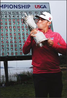 IN THIS JUNE 16, 2019, file photo, Gary Woodland poses with the trophy after winning the U.S. Open Championship golf tournament in Pebble Beach, Calif. Due to the coronavirus pandemic, the golf to watch on Father’s Day this year will not be the U.S. Open as is usually the case. (AP Photo)