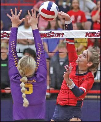 PONCA CITY players, Lindsay Hollis, left photo, and Baylee York, right photo, make plays at the net during volleyball action Monday against Arkansas City in Po-Hi’s Robson Field House. Arkansas City won the match three sets to one. The visitors won the first set 25-16. Ponca City came back to win set No. 2 25-23, but then Ark City won the final two sets 25-18 and 25-17. The Lady Cats will return to action Thursday by hosting Bixby at Robson. These photos were provided by Larry Williams.