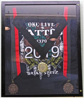 Studio 205’s awards from the OKC Live Tattoo Expos in both 2019 and 2020. (Photo by Calley Lamar)