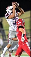 LANCE ARBONA of Ponca City goes high to pull down a pass during Friday’s game against Lawton. Ponca City won 42-8. This photo was provided by Dr. John Holden.