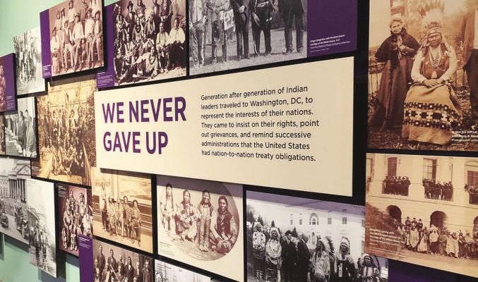 THE WORDS “We Never Gave Up” are written on a sign in the Smithsonian’s National Museum of the American Indian’s exhibit Nation to Nation: Treaties Between the United States and American Indian Nations. Photo by Addison Kliewer/Gaylord News.