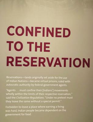 AN EXHIBIT in the Smithsonian’s National Museum of the American Indian describes life on reservations, comparing these areas to prisons. Photo by Addison Kliewer/Gaylord News.