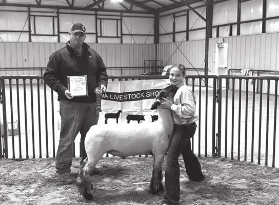 Grand Champion Wether Lamb, Annie Hodgson with show judge Justin Stacy.