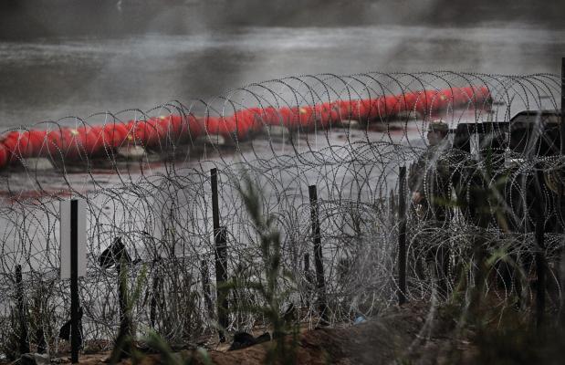 A FLOATING barrier is deployed in the middle of the Rio Grande which forms the U.S.- Mexico border at Eagle Pass, Texas, on Dec. 23, 2023. The Justice Department asked the Supreme Court to intervene and allow border agents to remove razor wire on the Texas side of the Rio Grande river. (Chandan Khanna/ AFP/Getty Images/TNS)