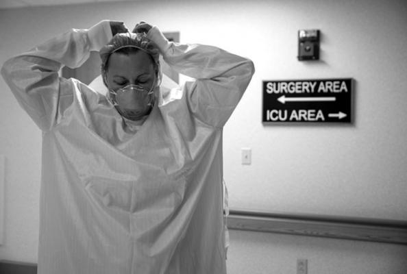 A healthcare professional suits up with PPE (Personal Protective Equipment) to enter a Covid-19 patient’s room in the ICU at Van Wert County Hospital in Van Wert, Ohio on November 20, 2020. - As Covid-19 numbers spike across Ohio, rural hospitals and staff take on the rising number of patients being admitted. (Megan Jelinger/AFP via Getty Images/TNS)