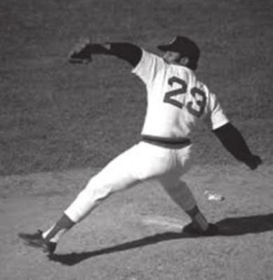 LUIS TIANT was a Cuban who had a great career with a number of teams including the Boston Red Sox. He had an unusual windup which included him turning his head out to center field.