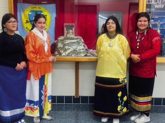 WEST MIDDLE School Title VI students Florence LeClair, Nora Feathers, Rayna Dent, and Kyleigh Bear greeted students and staff on Wednesday morning to kick off Native American Heritage Month. Photo provided