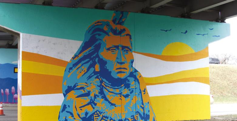 Local artist, Theresa Sacket, adds a splash of color to Ponca City with the mural project for the underpass on Highland. The four columns now hold paintings of icons to the community. (Photo by Dailyn Emery)
