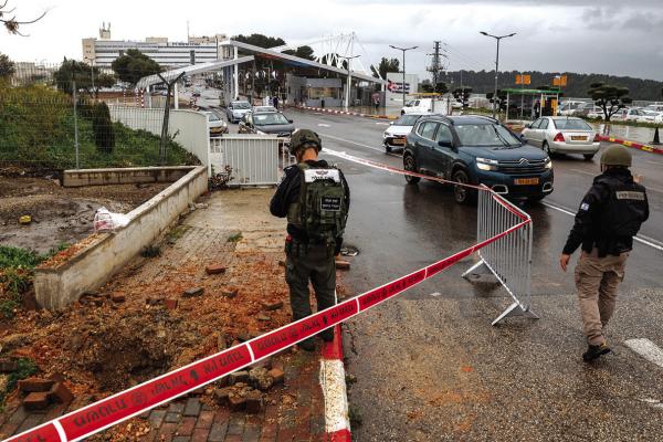AN ISRAELI policeman inspects the impact crater left by a rocket fired from southern Lebanon where it landed near the entrance of Ziv hospital in Israel’s northern city of Safed on Feb. 14, 2024, amid ongoing cross-border tensions as fighting continues between Israel and Palestinian Hamas militants in the Gaza Strip. (Jalaa Marey/AFP via Getty Images/TNS)