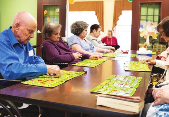 RESIDENTS AT a Norman senior -living facility gathered for bingo in November 2018. In recent weeks, many senior centers have discontinued events like these as they step up efforts to protect residents from catching the coronavirus. (Whitney Bryen/Oklahoma Watch)