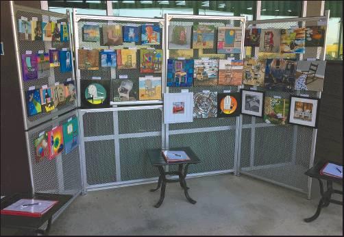 PICTURED ARE 46 original chair-inspired works of art that were for purchase by silent auction. The works were donated to the North Central Oklahoma Art Council Chair-ity Event by area artists - ranging from middle school students to professional painters and photographers. This photo was taken by Ken Crowder.