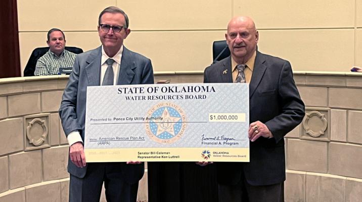 JOE FREEMAN (left), Chief of the Financial Assistance Division makes an Oklahoma Water Resources Board (OWRB) Oklahoma American Rescue Plan Act (ARPA) grant presentation to the Ponca City Utility Authority (PCUA) and presents the check to Mayor Homer Nicholson (right). (Photo by Calley Lamar)