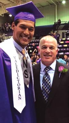 ZAVEN COLLINS and Coach Scott Harmon pose at Collins’ graduation at Hominy High School as a member of the Class of 2017.
