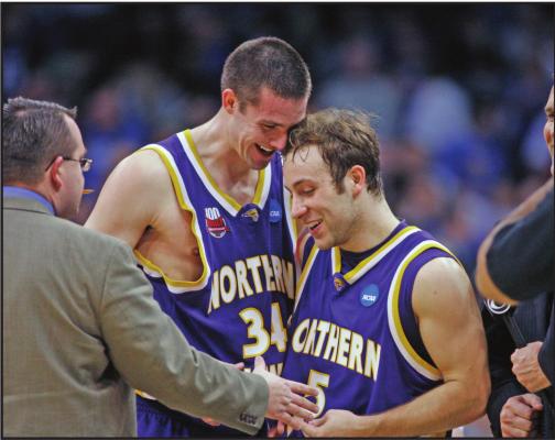 NORTHERN IOWA forward Adam Kock (34) congratulates teammate Ali Farokhmanesh after a 2010 NCAA first-round college basketball game against UNLV, in Oklahoma City. This is the time of year that people will usually start tweeting at Ali Farokhmanesh. There will be Northern Iowa fans that remember his back-to-back buzzer-beaters to beat UNLV and Kansas and usher the Panthers to the Sweet 16 of the NCAA Tournament a decade ago. (AP Photo)