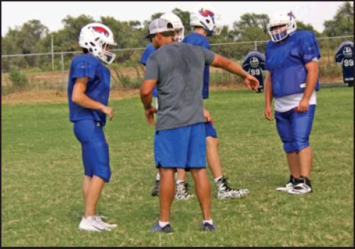 Schanbacher gives instructions to members of his Deer Creek-Lamont Eagles football team during practice Tuesday in Lamont. The Eagles will open their 2019 season with a game Sept. 30 against Kremlin-Hillsdale in Kremlin. (News Photo by David Miller)