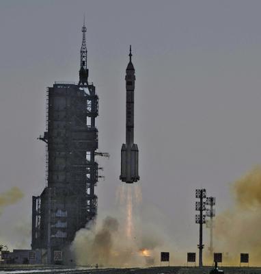 A LONG March-2F carrier rocket, carrying the Shenzhou-17 spacecraft and a crew of three astronauts, lifts off from the Jiuquan Satellite Launch Centre in the Gobi desert, in northwest China on Oct. 26, 2023. (Pedro Pardo/AFP via Getty Images/TNS)