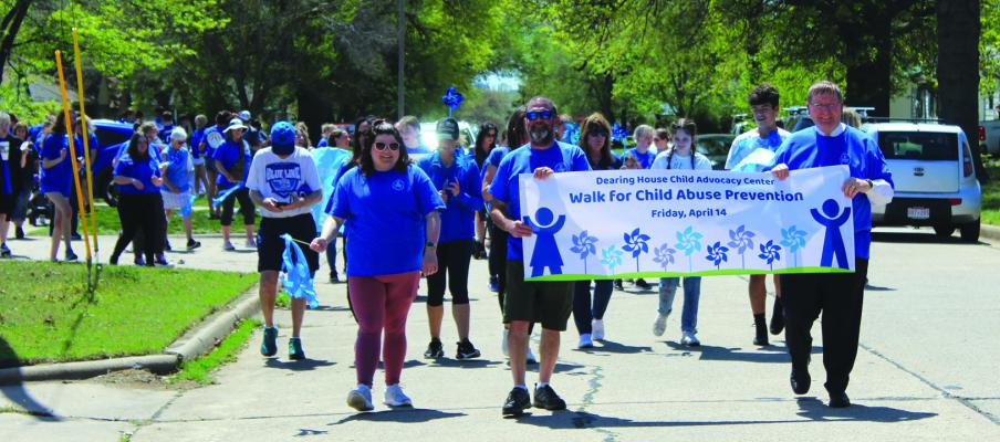 Participants for the Steppin Out awareness walk gathered at Dearing House and made the trek to City Central on Friday, April 14. (Photo by Calley Lamar)