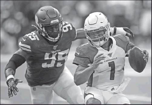 ARIZONA CARDINALS quarterback Kyler Murray (1) runs from Minnesota Vikings defensive end Ifeadi Odenigbo (95) during the first half of an NFL preseason football game, Saturday in Minneapolis. (AP Photo)
