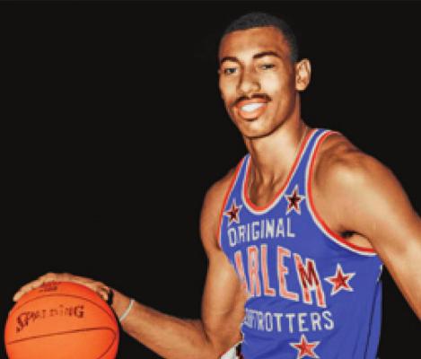 WILT CHAMBERLAIN was a member of the 1957 Kansas team that lost in three overtimes to North Carolina in the NCAA finals. Chamberlain left Kansas after the 1958 season to play a year for the Harlem Globetrotters.