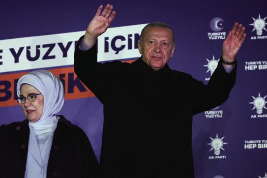 TURKISH PRESIDENT Recep Tayyip Erdogan (R), accompanied by his wife Emine Erdogan (L), wave to supporters at the AK Party headquarters in Ankara, Turkey on May 15, 2023. Turkey is braced for its first election runoff after a night of high drama showed the President edging ahead of his secular rival but failing to secure a first-round win. (Adem Altan/AFP via Getty Images/TNS)