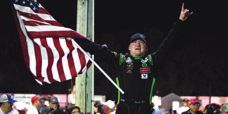 Driver Brenden Queen celebrates his victory in the Hampton Heat 200 on July 18, 2020, at Langley Speedway in Hampton. Staff file