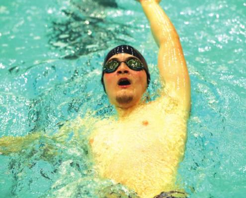 TANNER ESTES of Ponca City swims the backstroke during a dual Thursday with Tulsa’s Bishop Kelley at the RecPlex. Bishop Kelley. a perennial state champion team dominated by winning the boys event 127-37 and the girls event 89-46. This photo was provided by Larry Williams.