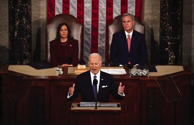 US Vice President Kamala Harris and US Speaker of the House Kevin McCarthy (R-CA) listen as US President Joe Biden delivers the State of the Union address in the House Chamber of the US Capitol in Washington, DC, on Feb. 7, 2023. (Andrew Caballero-Reynolds/AFP via Getty Images/TNS)