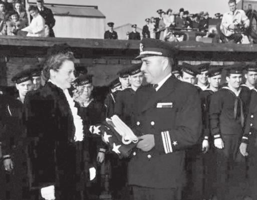 Lt. Cmdr. Ernest E. Evans, USN (1908-1944) at the commissioning ceremony for USS Johnston (DD-557), Seattle, Washington, 27 October 1943. He was Johnston's Commanding Officer from then until she was sunk in the Battle off Samar, 25 October 1944, and was lost with the ship. (U.S. Navy Photo/RELEASED)