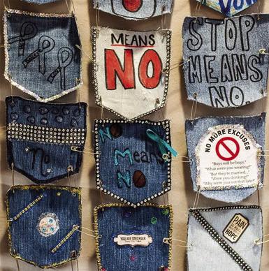 DENIM POCKETS decorated with messages about sexual assault hang on the conference room wall at New Directions in Lawton. New Directions is one of 28 victim service programs statewide that pay an $1,000 annual membership fee to receive support from the Oklahoma Coalition Against Domestic Violence and Sexual Assault. (Whitney Bryen/Oklahoma Watch)