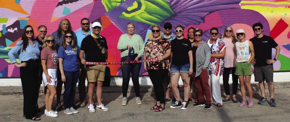 A RIBBON cutting ceremony was held for the Unity Mural on Tuesday, June 13. Pictured are various members of Ponca City Main Street, City Arts, their boards and the artists. Cutting the ribbon is Ponca City Main Street Board Chair, Chelsi Hendrickson. (Photo by Calley Lamar)