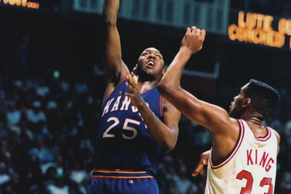 OKLAHOMA AND Kansas, Big 12 Conference rivals, met in the NCAA national championship game in 1988. Despite the facts that Oklahoma was ranked No. 1, Kansas had lost 11 games that season and the Sooners had beaten the Jayhawks in two earlier meetings, Kansas emerged the victor in the national title game. Here Danny Manning of Kansas, the leader of the team that later was dubbed Danny and the Miracles, shoots over OU’s Stacey King.
