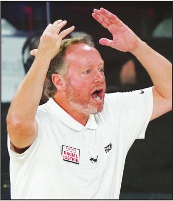 MILWAUKEE BUCKS head coach Mike Budenholzer reacts during the second half of an NBA conference semifinal playoff basketball game against the Miami Heat Wednesday, Sept. 2, 2020, in Lake Buena Vista, Fla. (AP Photo/Mark J. Terrill)