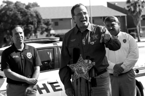 Polk County Sheriff Grady Judd, center, speaks during a news conference Sunday, Sept. 5, 2021, outside Lake Gibson High School in Lakeland, Florida. (Ivy Ceballo/Tampa Bay Times/TNS)