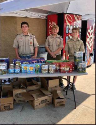 BOY SCOUT Troop 524 of the Cimarron Council was selling popcorn at the local Wal-Mart on Saturday, and will be back from 10 a.m. to 4 p.m. on Saturday, Sept. 21 at both the east and west entrances to the store. Pictures are (l-r) Jason Palmer, Landon Blakey, and Dalton Kirtchner. (News Photo by Mike Seals)