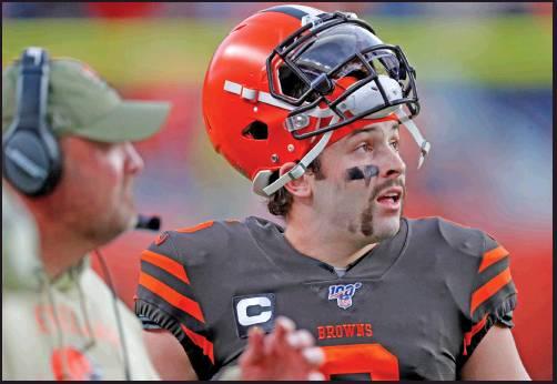 CLEVELAND BROWNS quarterback Baker Mayfield (6) looks at the scoreboard during a coaches challenge during an NFL game against the Denver Broncos Sunday in Denver. Mayfield is sporting facial hair, and his style has varied from a fu-manchu, to handlebars, to no hair at all depending on Mayfield’s performance on the field. (AP Photo)