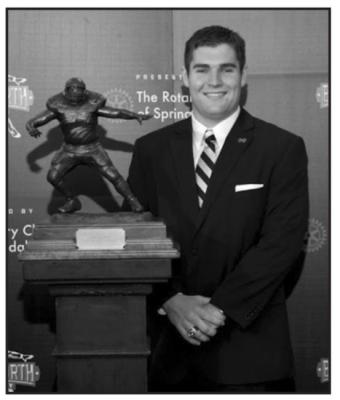 SEAN BEDFORD of Georgia Tech poses with the Burlsworth Trophy he won in 2010. He was the first recipient of the award which has been give to the top Division I football walk-on of the season. Like Burlsworth, he was an offensive lineman and an Academic All-American.