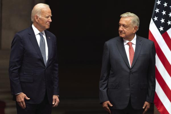 U.S. President Joe Biden (L) and his Mexican counterpart Andres Manuel Lopez Obrador attend a welcome ceremony at Palacio Nacional (National Palace) in Mexico City, on Jan. 9, 2023. (NICOLAS ASFOURI/AFP via Getty Images/TNS)