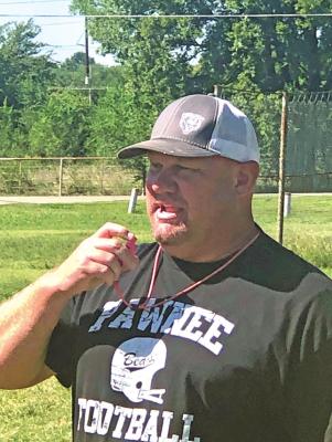 COACH RUSSELL Cook of Pawnee directs a recent practice of his Black Bears team. (News Photo by David Miller)