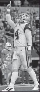 DALLAS COWBOYS quarterback Dak Prescott (4) celebrates his touchdown run against the Miami Dolphins in an NFL game in Arlington, Texas, Sept. 22. (AP Photo)