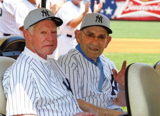 WHITEY FORD, left, and iconic Yogi Berra spent time together at an Old-Timers game in New York. Ford, one of the top pitchers in MLB history had a ring made for him that would aid him in scuffing up baseballs.